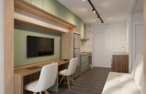 Layout linear de studio compacto com home office, cozinha e lavanderia na mesma faixa